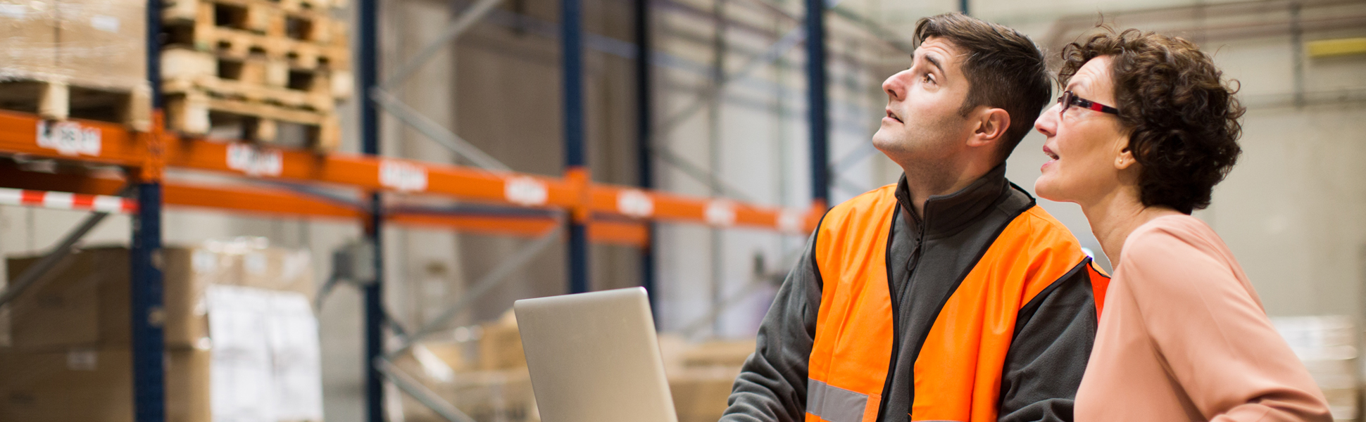 Two people working in warehouse