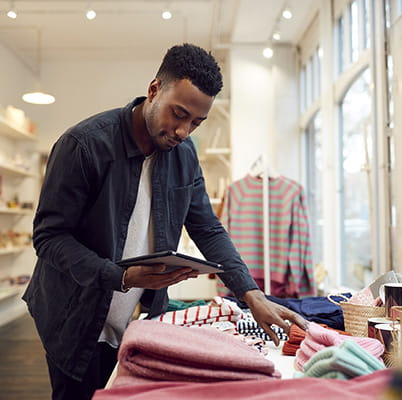 Man working in clothing storeroom